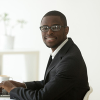 african-american-smiling-businessman-suit-glasses-looking-camera_1163-3902